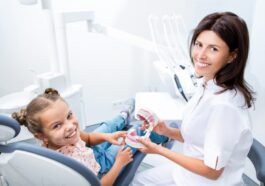little girl smiling with her dentist